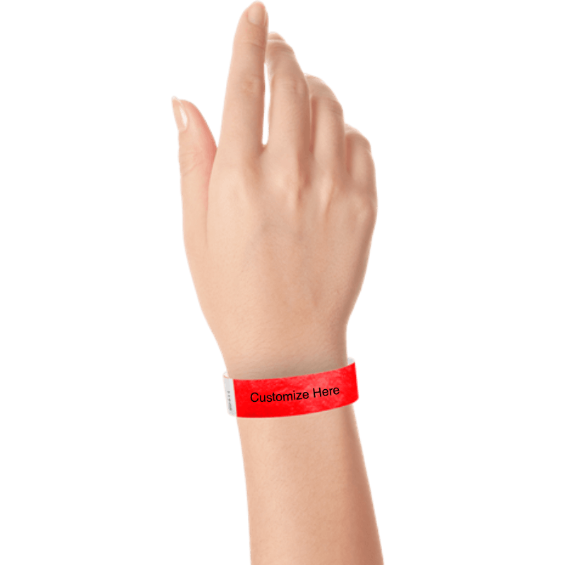 wrist wearing tyvek 3/4" solid wristband showing placeholder for customization in neon red