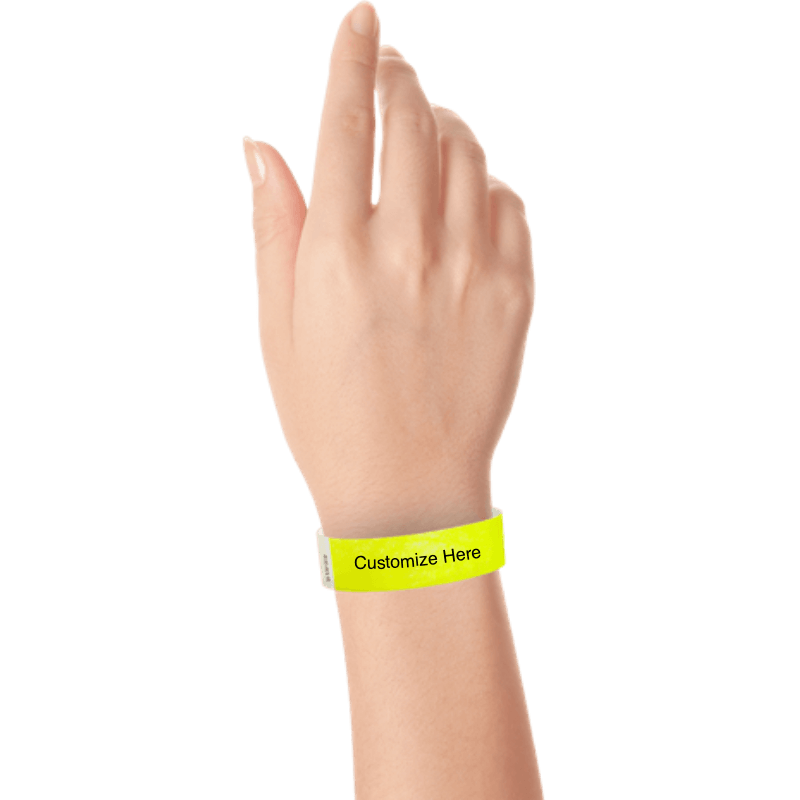 wrist wearing tyvek 3/4" solid wristband showing placeholder for customization in neon yellow