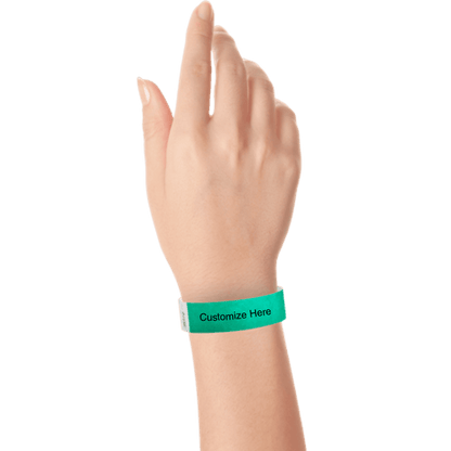 wrist wearing tyvek 3/4" solid wristband showing placeholder for customization in pantone green