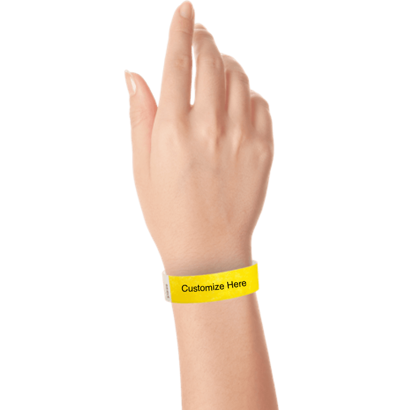 wrist wearing tyvek 3/4" solid wristband showing placeholder for customization in pantone yellow