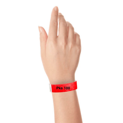 a hand wearing tyvek 3/4" solid wristband neon red pks 100