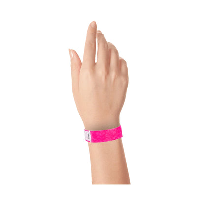 Wrist wearing solid neon pink qwik fit tyvek 3-4 wristband 