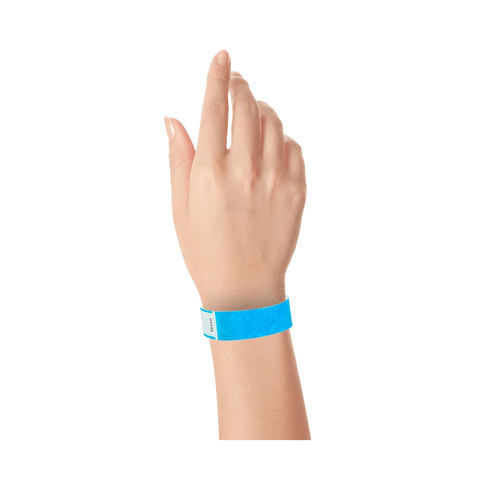 Wrist wearing solid neon blue qwik fit tyvek 3-4 wristband 