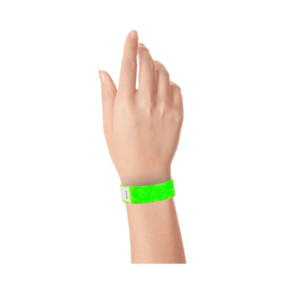 Wrist wearing solid neon green qwik fit tyvek 3-4 wristband 
