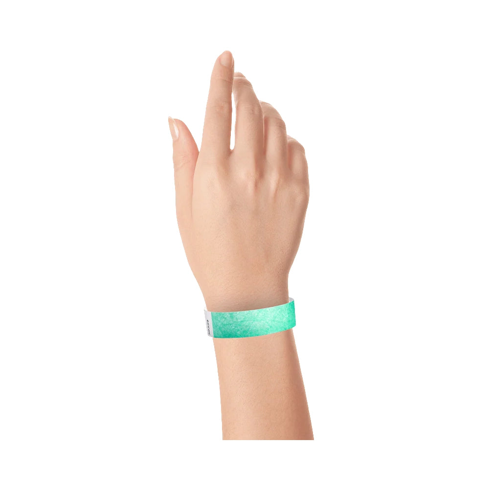 Wrist wearing tyvek wristband in aqua 