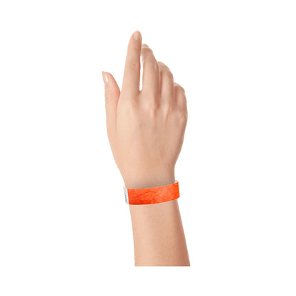 Coral red tyvek wristband on wrist 