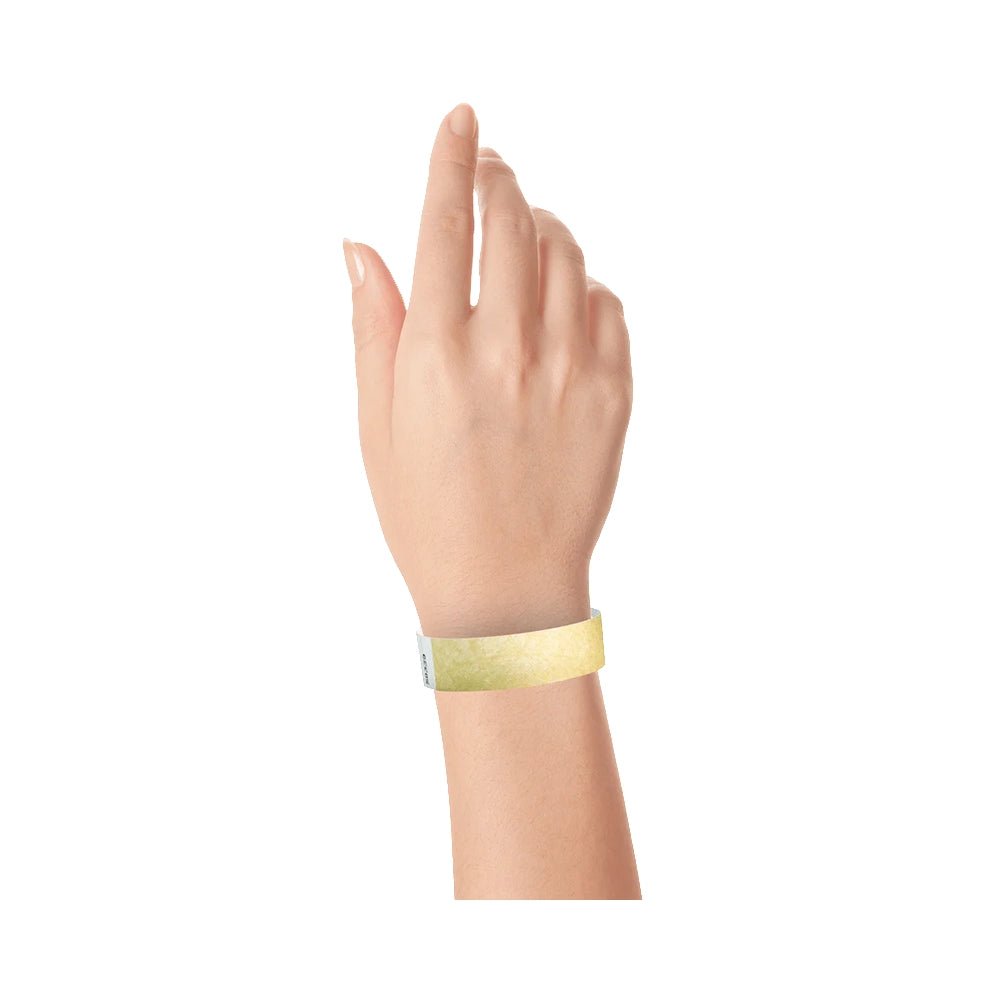 Gold tyvek wristband on wrist 