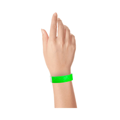 Wrist wearing tyvek wristband in neon green 