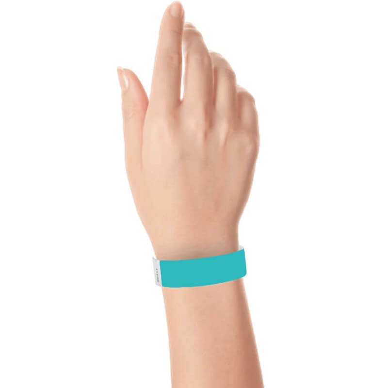 hand wearing a 3/4" tyvek wristband solid carribean blue