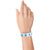 Hand wearing a white tyvek wristband with neon blue stars 