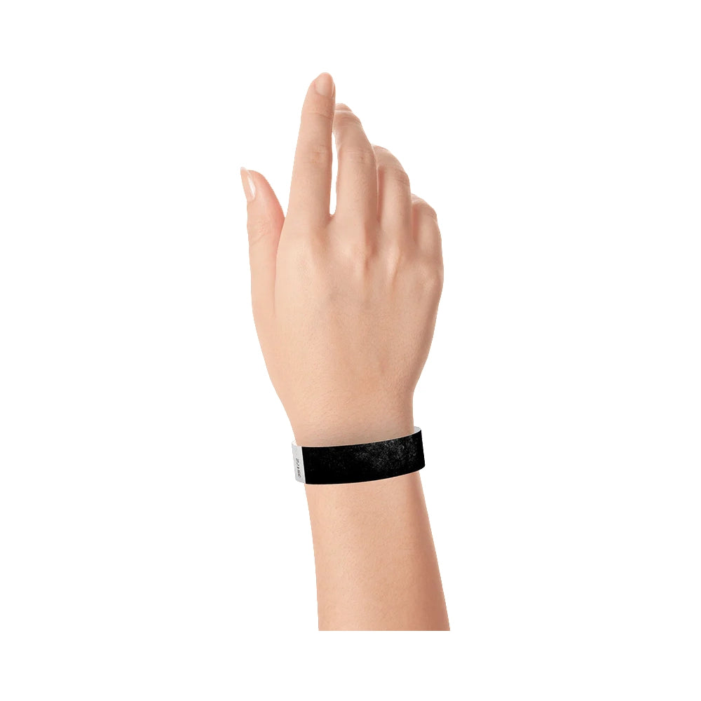 Black solid tyvek wristband on wrist 