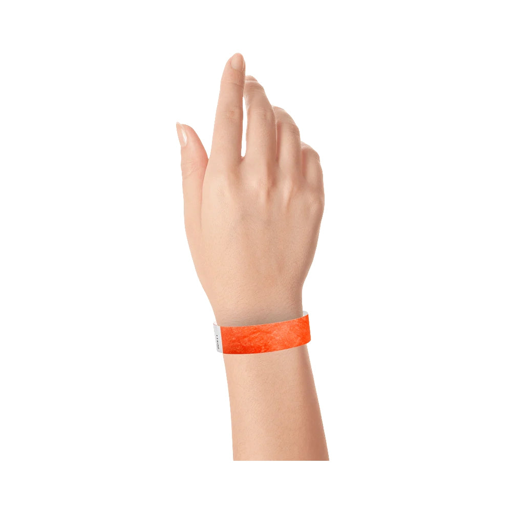 Coral red solid tyvek wristband on wrist  