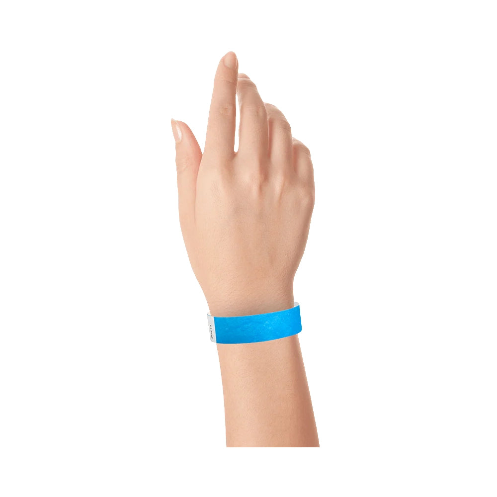 Neon blue solid tyvek wristband on wrist