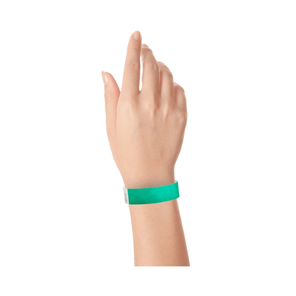 Pantone green solid tyvek wristband on wrist