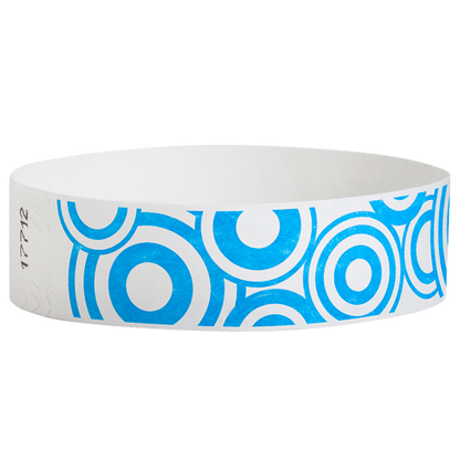 neon blue disk pattern on a white tyvek wristband - round version shown