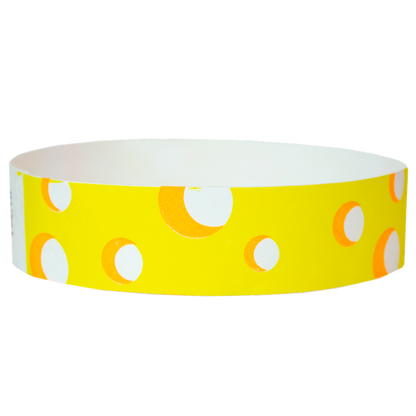 white tyvek wristband with neon yellow cheese pattern - round version shown