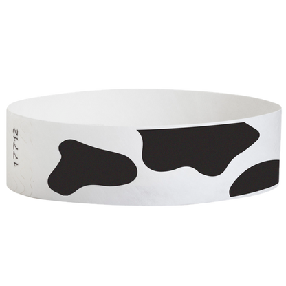 white tyvek wristband with cow pattern - round version shown