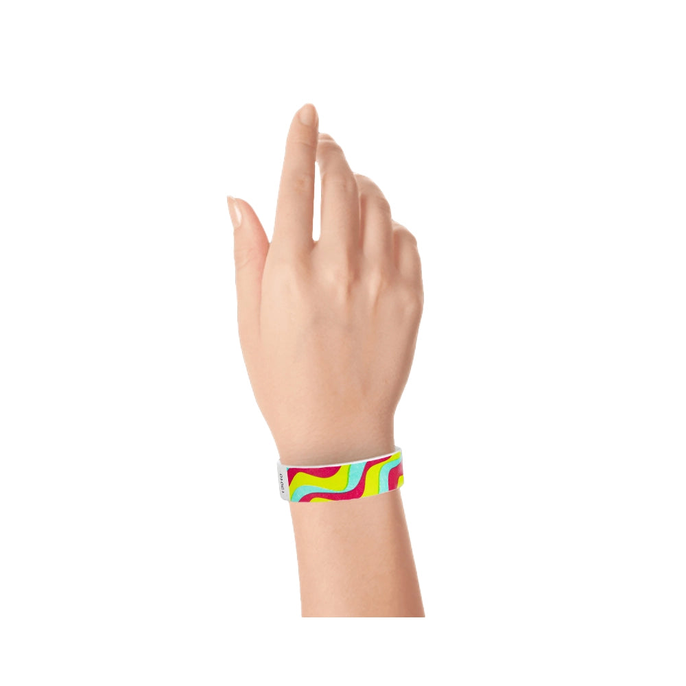 tyvek 3/4" wristband with neon red, neon yellow and aqua groovy stripe pattern shown on hand 