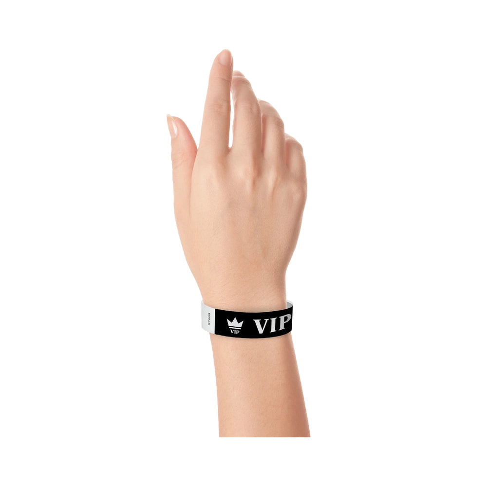 Hand wearing Black wristband with text "VIP" and a crown printed in Silver