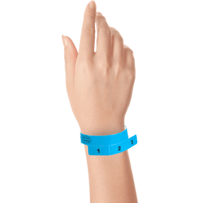 vinyl 3 tab wristbands shown in stock pattern with imprint "stub void if detached" and the number 1-3 on the stubs in navy blue on hand 