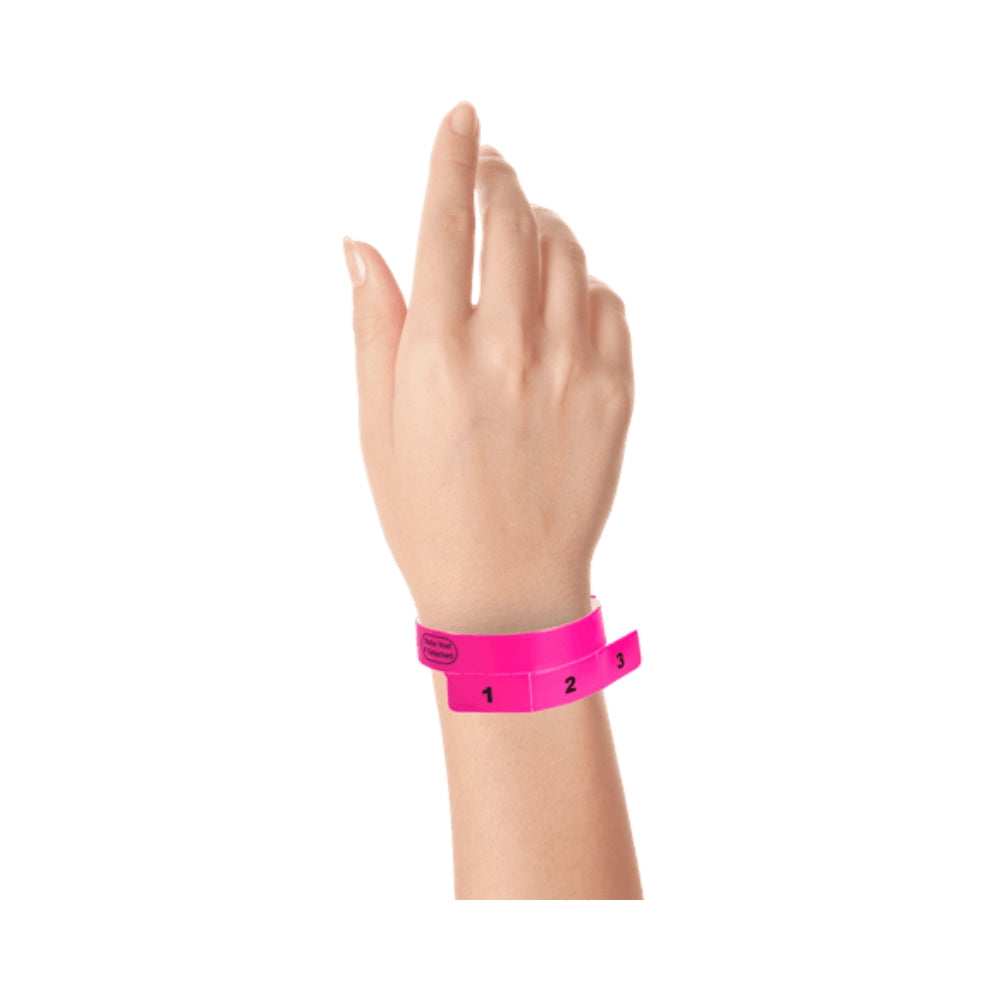 vinyl wristband with 3 tab in neon pink - shown on wrist 