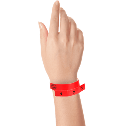 vinyl 3 tab wristbands shown in stock pattern with imprint "stub void if detached" and the number 1-3 on the stubs in neon red on hand 