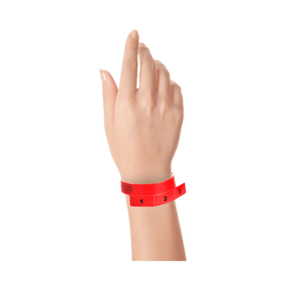 vinyl wristband with 3 tab in neon red - shown on wrist 