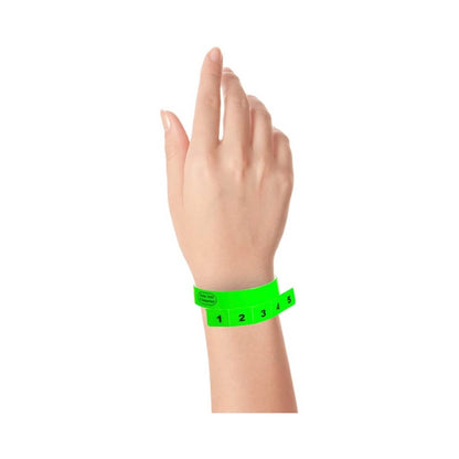 vinyl wristband with 5 tabs in neon green - shown on wrist