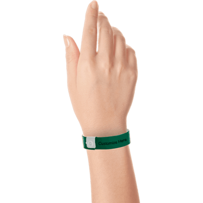 hand wearing regular vinyl wristbands with a placeholder to show where you can customize the wristband in forest green