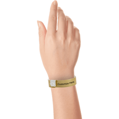 hand wearing regular vinyl wristbands with a placeholder to show where you can customize the wristband in gold