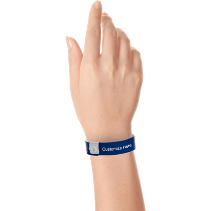 hand wearing regular vinyl wristbands with a placeholder to show where you can customize the wristband in navy blue