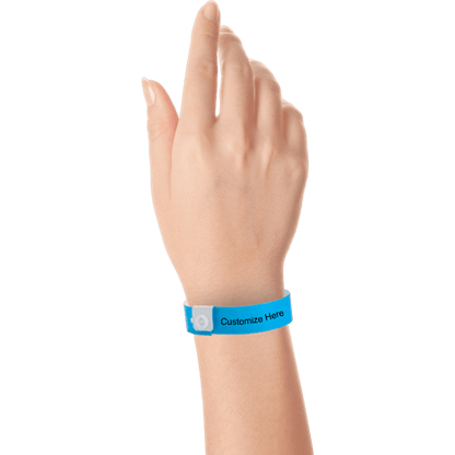 hand wearing regular vinyl wristbands with a placeholder to show where you can customize the wristband in neon blue