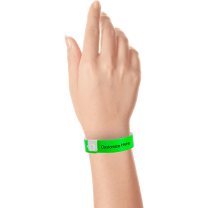 hand wearing regular vinyl wristbands with a placeholder to show where you can customize the wristband in neon green