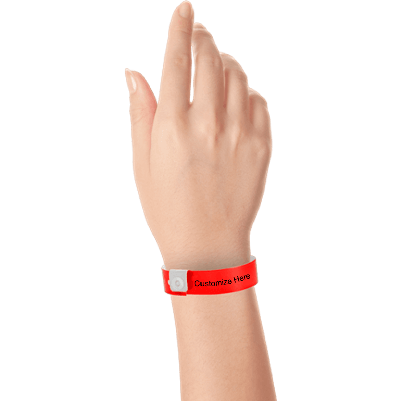 hand wearing regular vinyl wristbands with a placeholder to show where you can customize the wristband in neon red