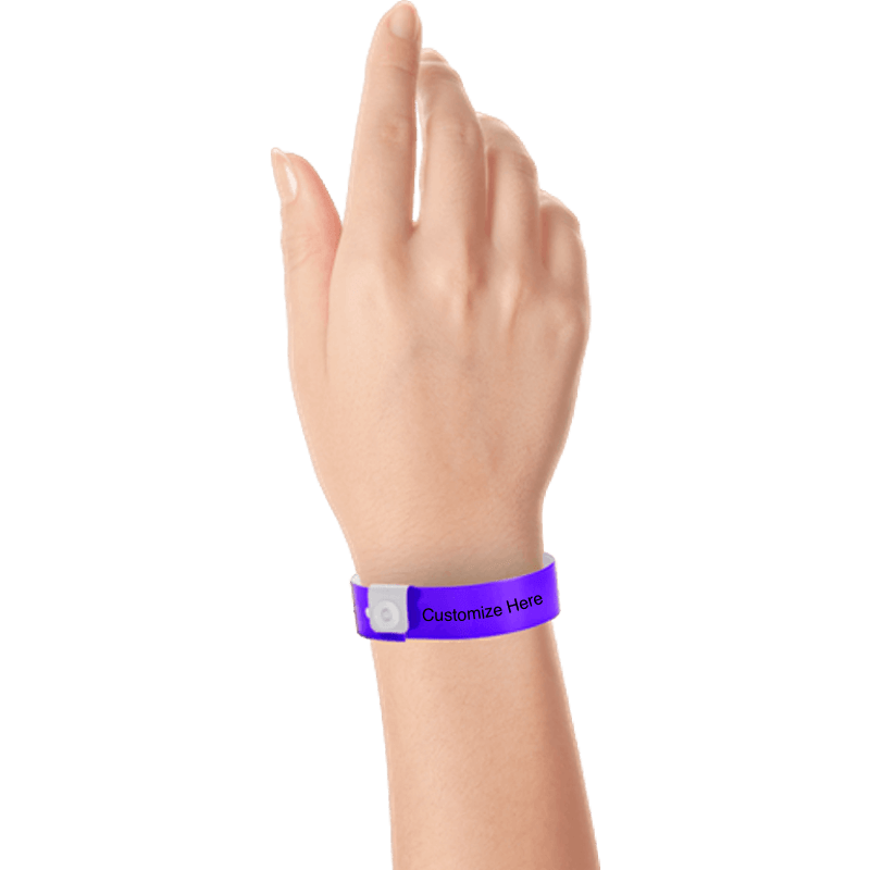 hand wearing regular vinyl wristbands with a placeholder to show where you can customize the wristband in purple
