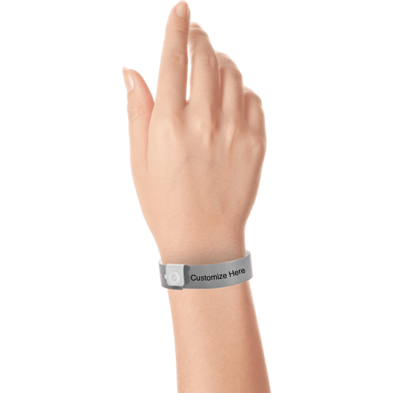 hand wearing regular vinyl wristbands with a placeholder to show where you can customize the wristband in silver