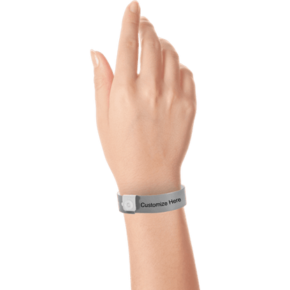 hand wearing regular vinyl wristbands with a placeholder to show where you can customize the wristband in silver