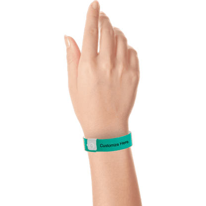 hand wearing regular vinyl wristbands with a placeholder to show where you can customize the wristband in teal