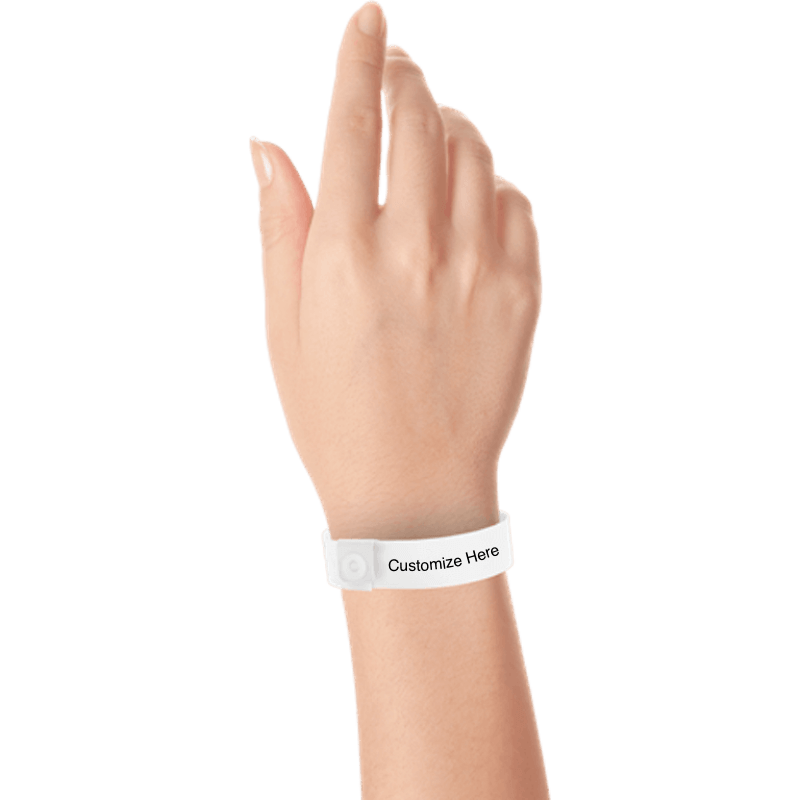 hand wearing regular vinyl wristbands with a placeholder to show where you can customize the wristband in white
