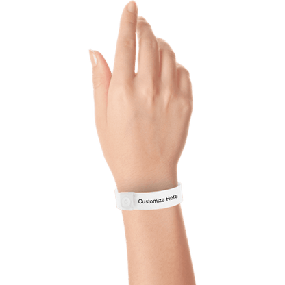 hand wearing regular vinyl wristbands with a placeholder to show where you can customize the wristband in white