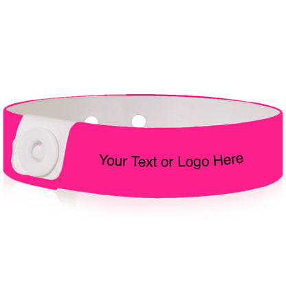 Slim vinyl wristbands with a placeholder to show where you can customize the wristband shown in neon pink