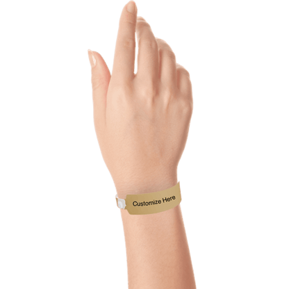 Hand wearing wide face vinyl wristbands with a placeholder to show where you can customize the wristband in gold