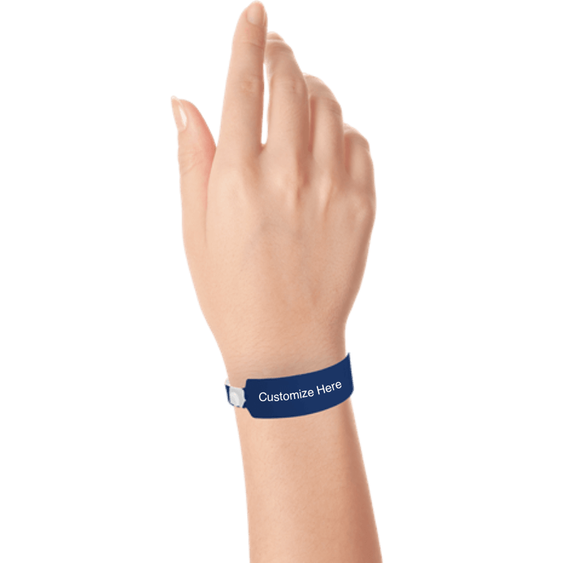Hand wearing wide face vinyl wristbands with a placeholder to show where you can customize the wristband in navy blue 