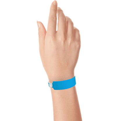 Wide face vinyl solid wristbands on hand in neon blue 