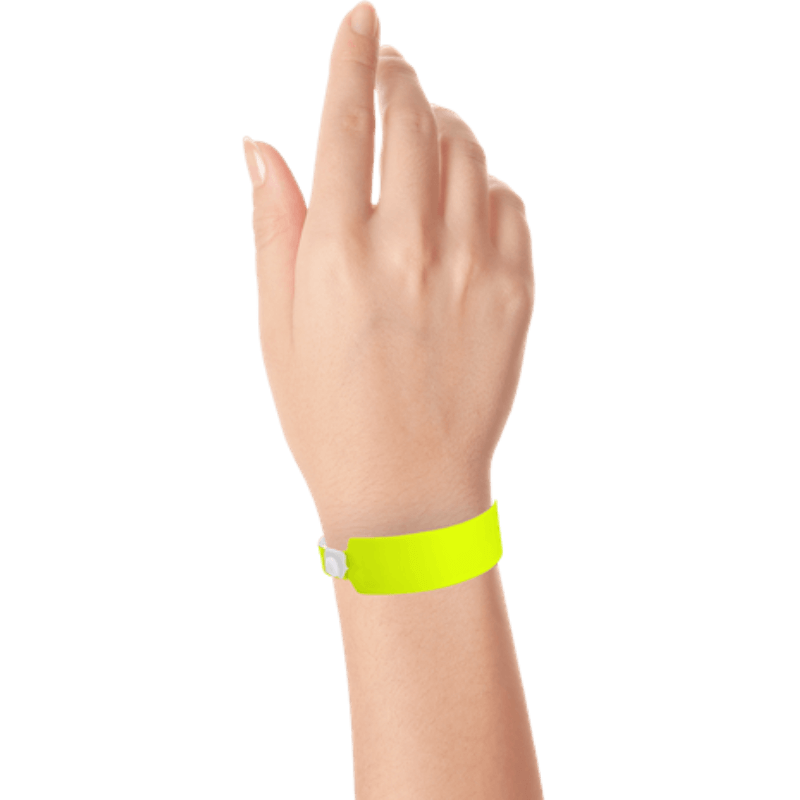 Wide face vinyl solid wristbands on hand in neon yellow