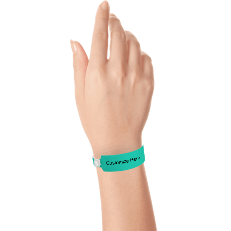 Hand wearing wide face vinyl wristbands with a placeholder to show where you can customize the wristband in teal