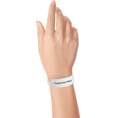 Hand wearing wide face vinyl wristbands with a placeholder to show where you can customize the wristband in white