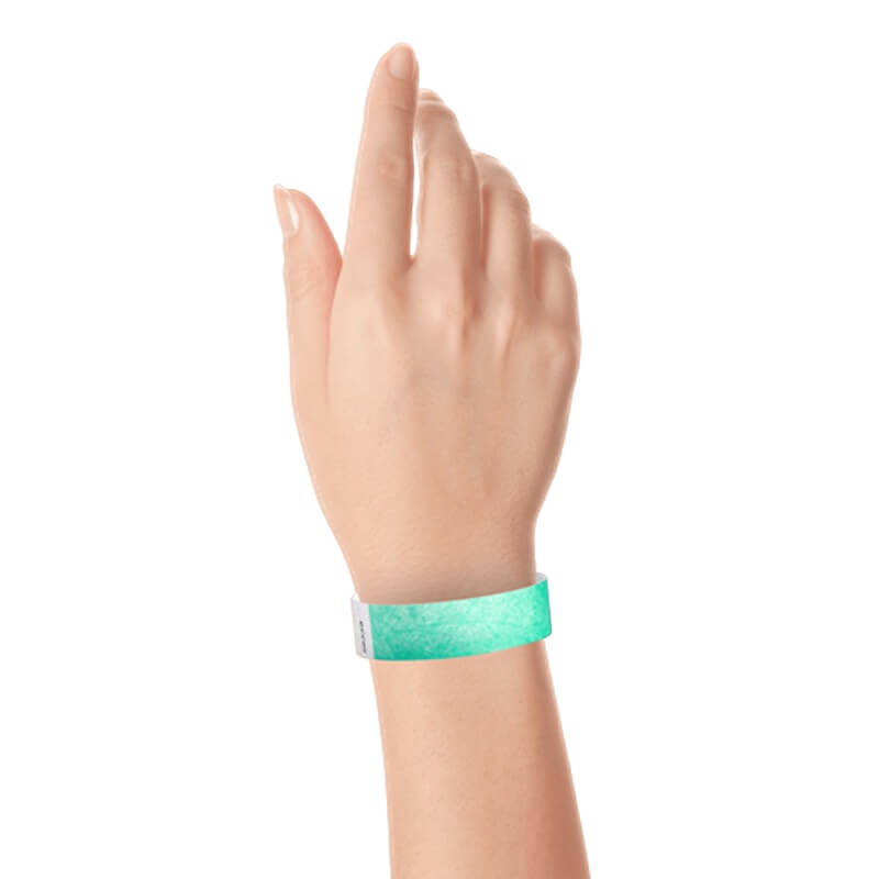 hand wearing a  3/4" tyvek wristband solid aqua