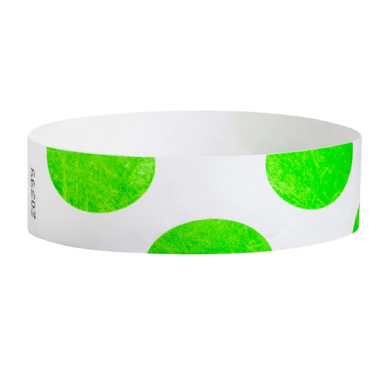 White wristband with neon green half circles on - shown in round 