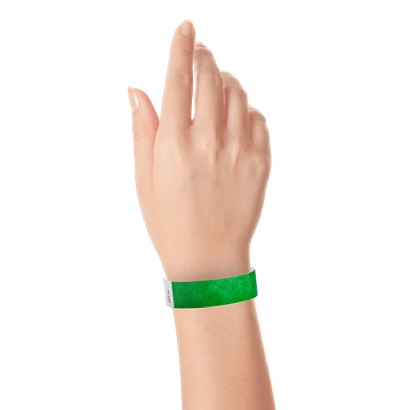 hand wearing a  3/4" tyvek wristband solid kelly green